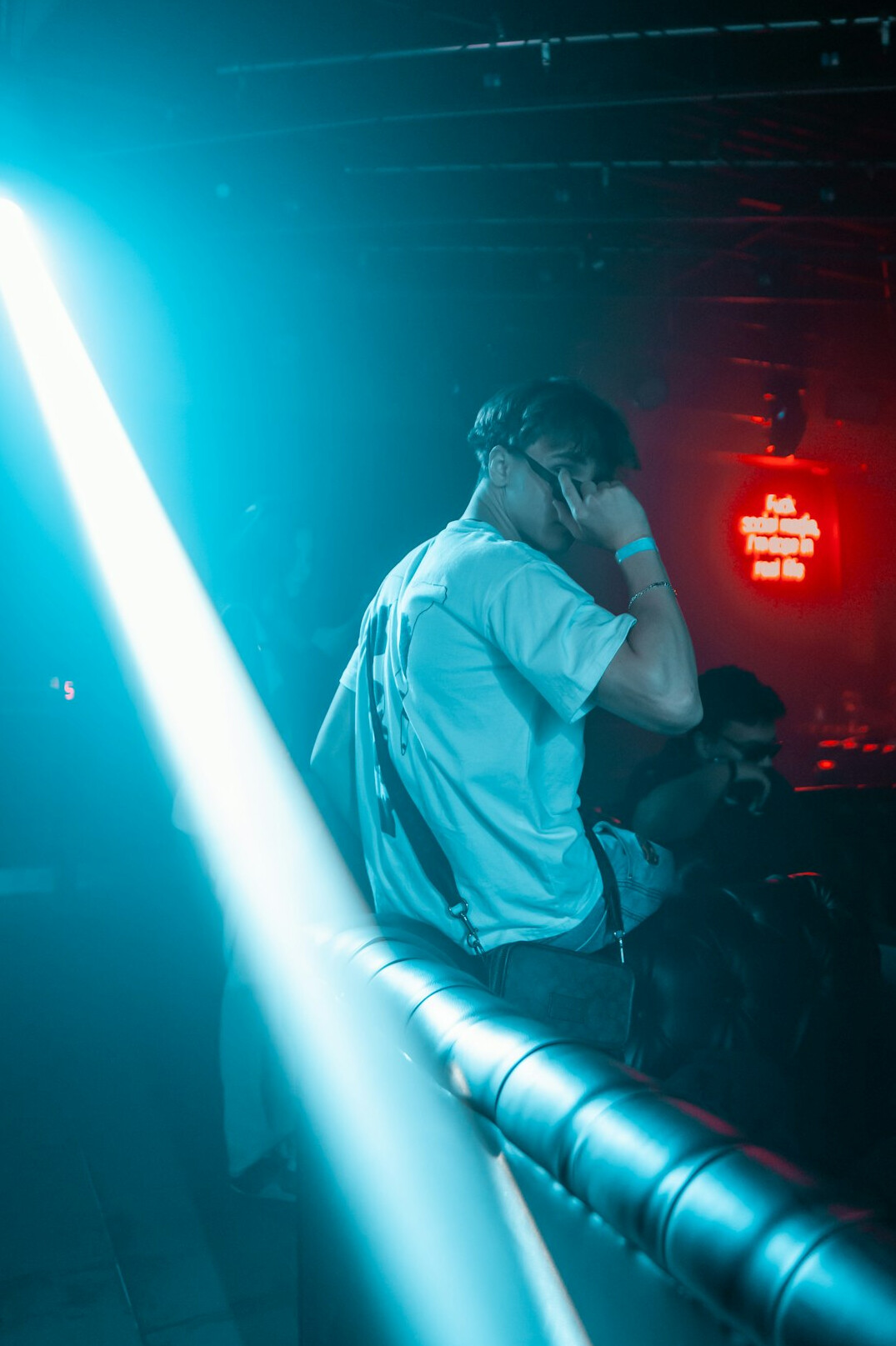 Photographer taking pictures at a glamorous event with bright stage lights